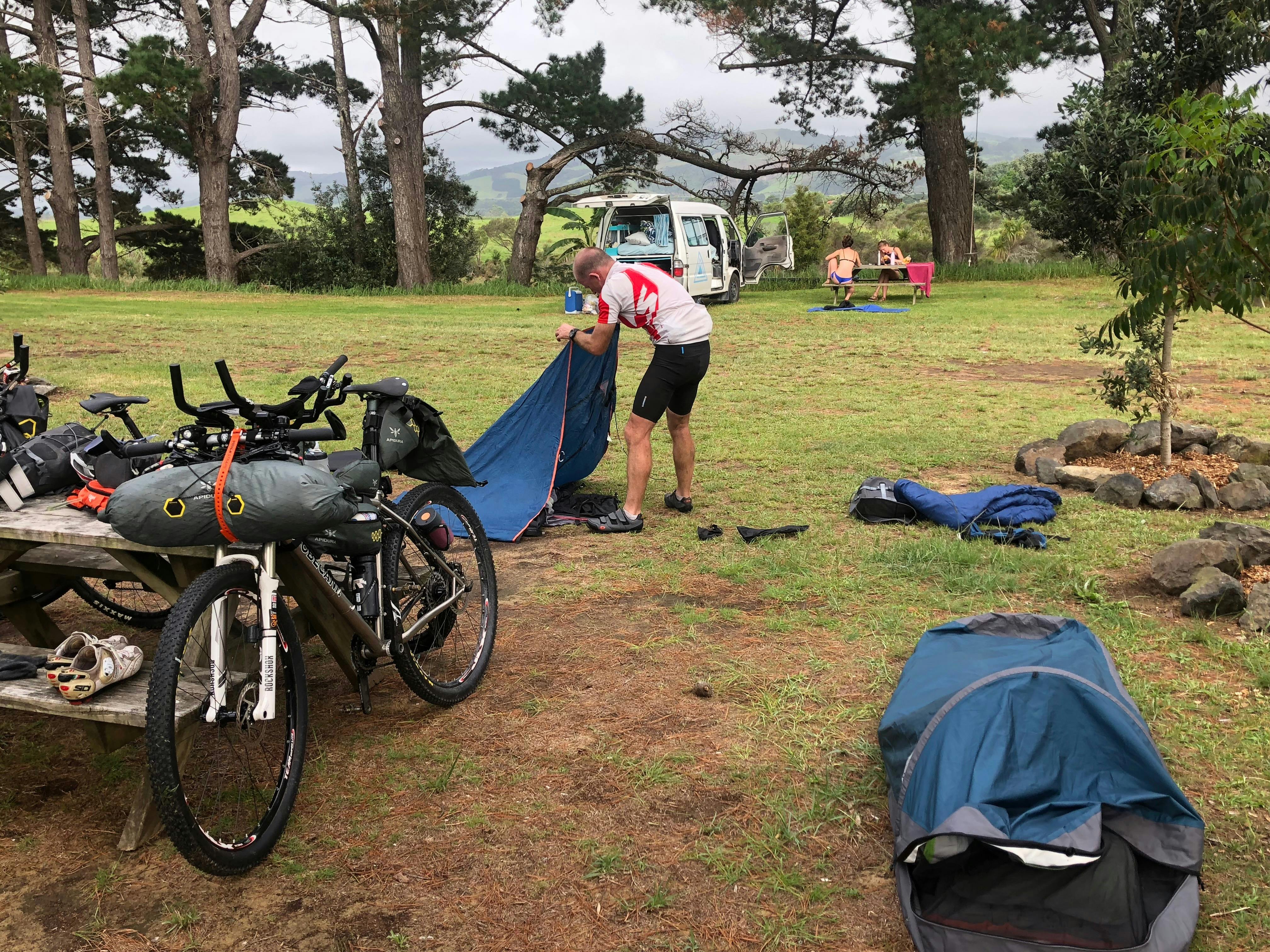 Rider setting up hike tent at camping reserve