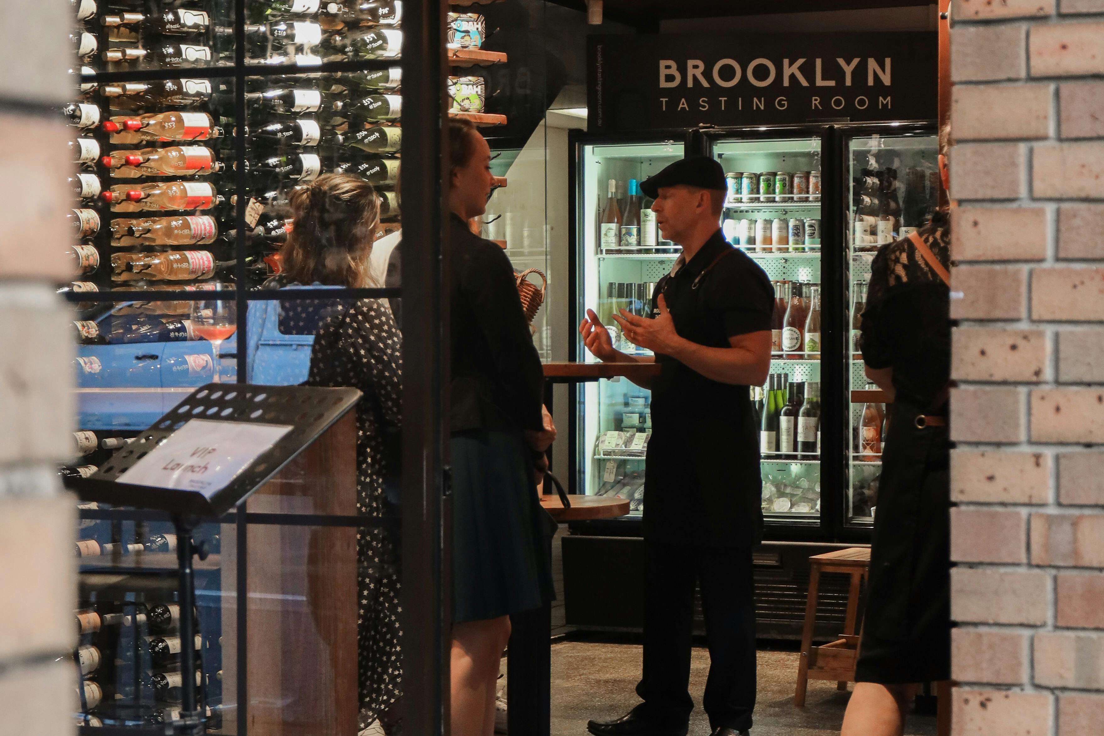 Discussing a wine with a brooklyn Tasting Room sommelier.