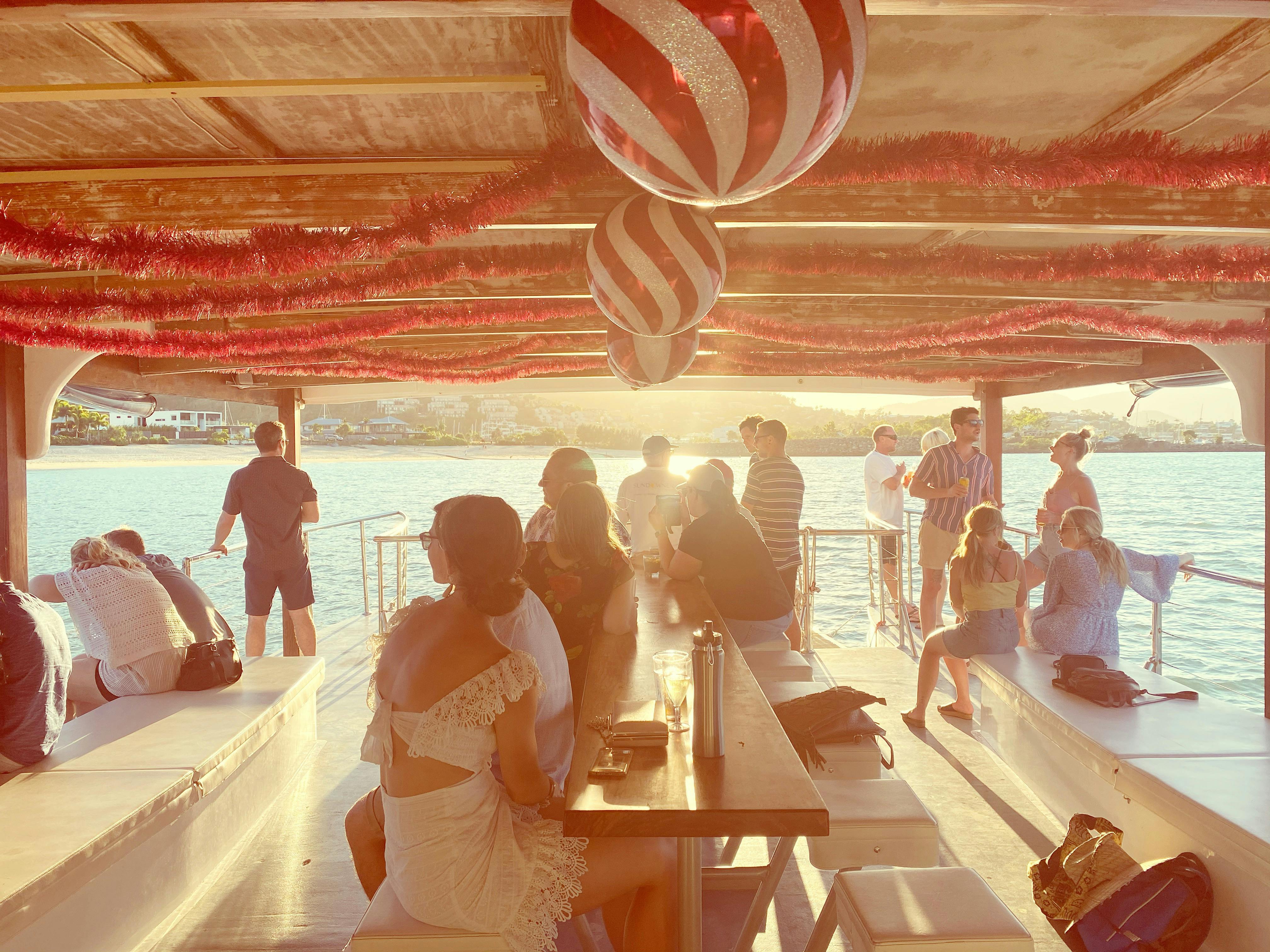 Sundowner sunset cruise around Airlie Beach, your floating bar