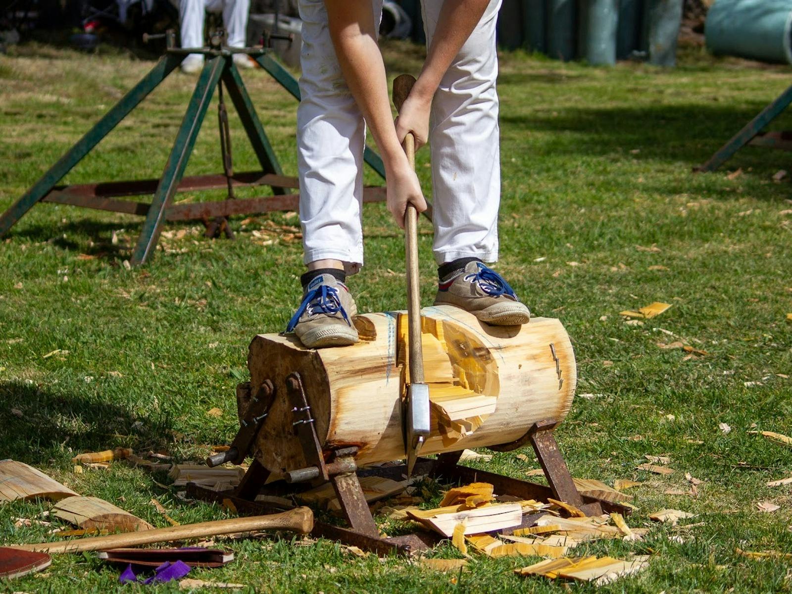 Axeman cutting a log