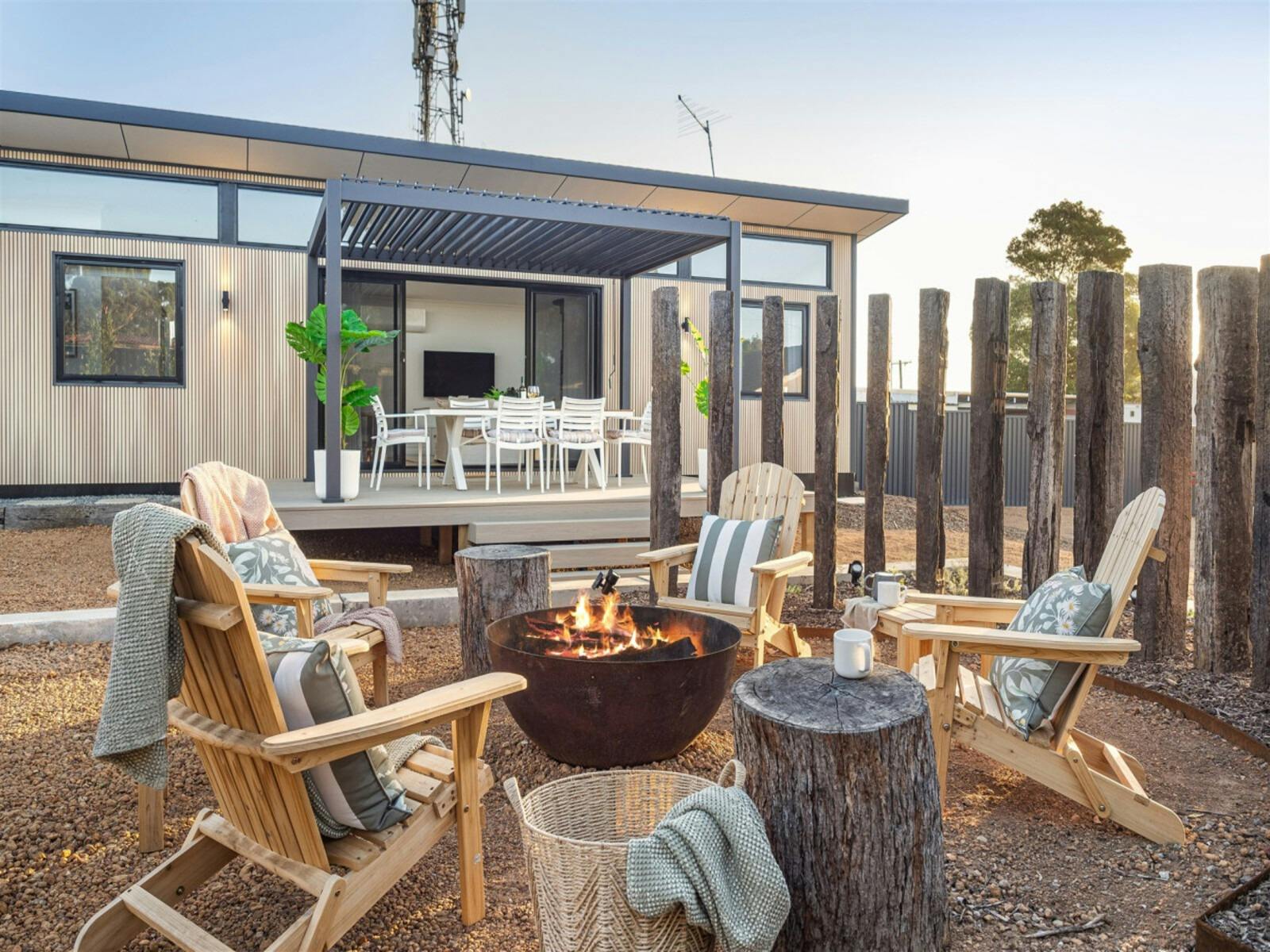 Private Firepit with Outdoor Seating Cushions & Rugs