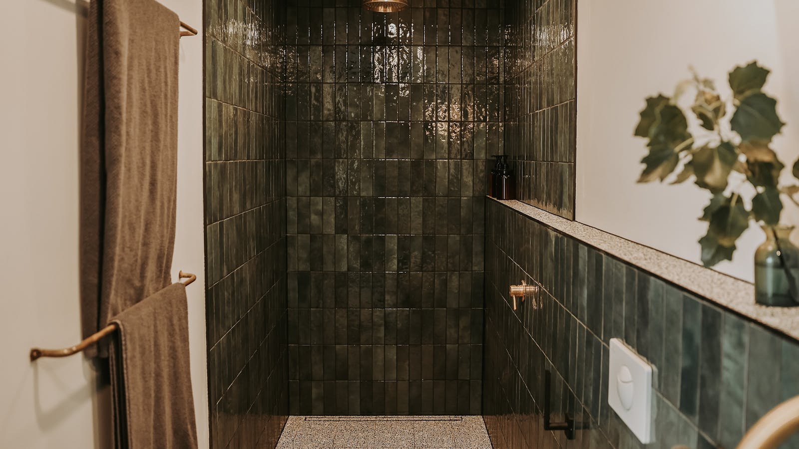 Heated floors and a rainfall shower await.