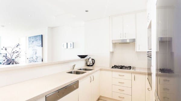 Spacious Kitchen area with Fridge, Dishwasher, Stove, Oven, Microwave and Utensils