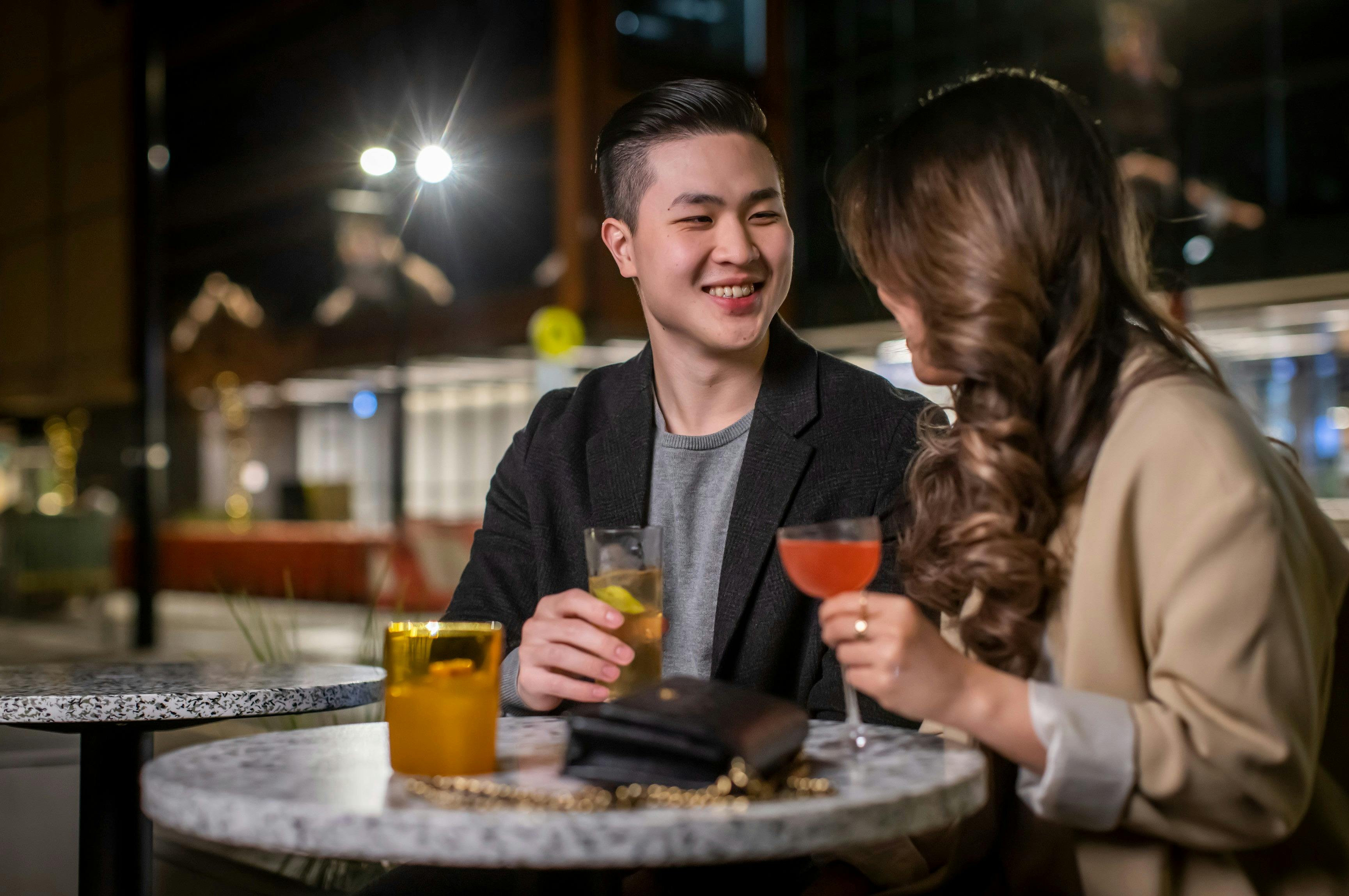 Couple enjoying cocktails at Re bar, Sydney