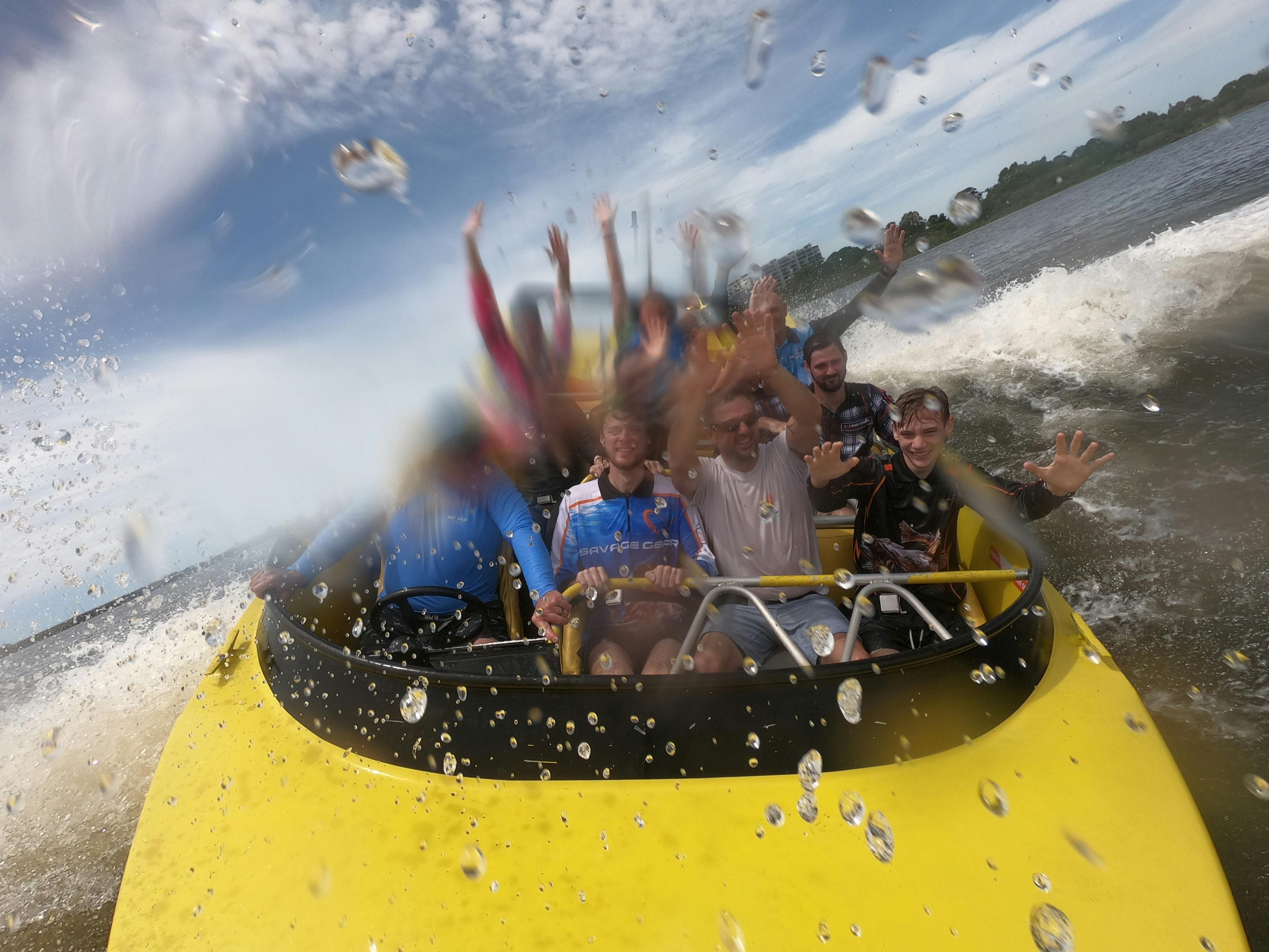 Passengers enjoying jet boat ride