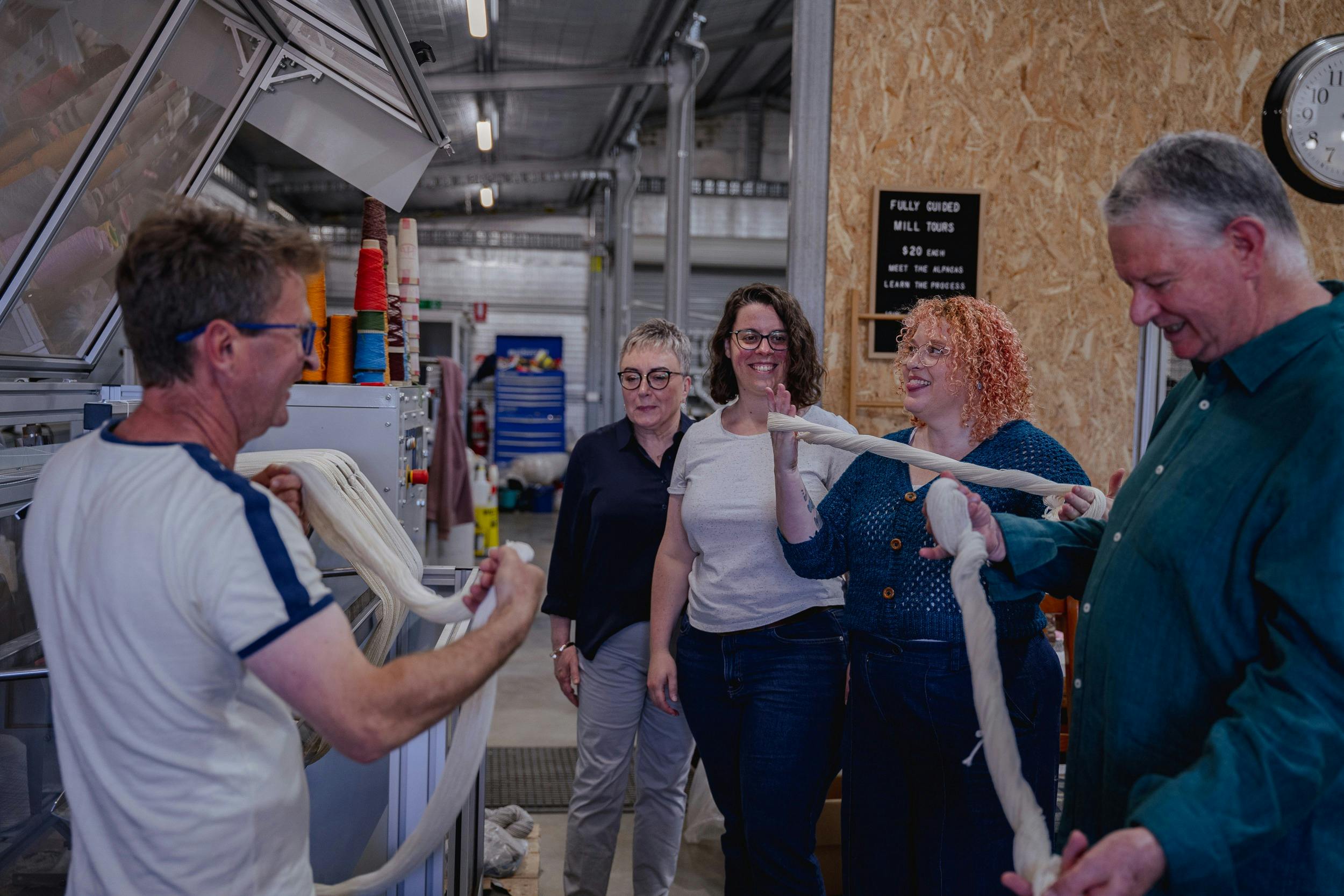 several people trying to wind a skein