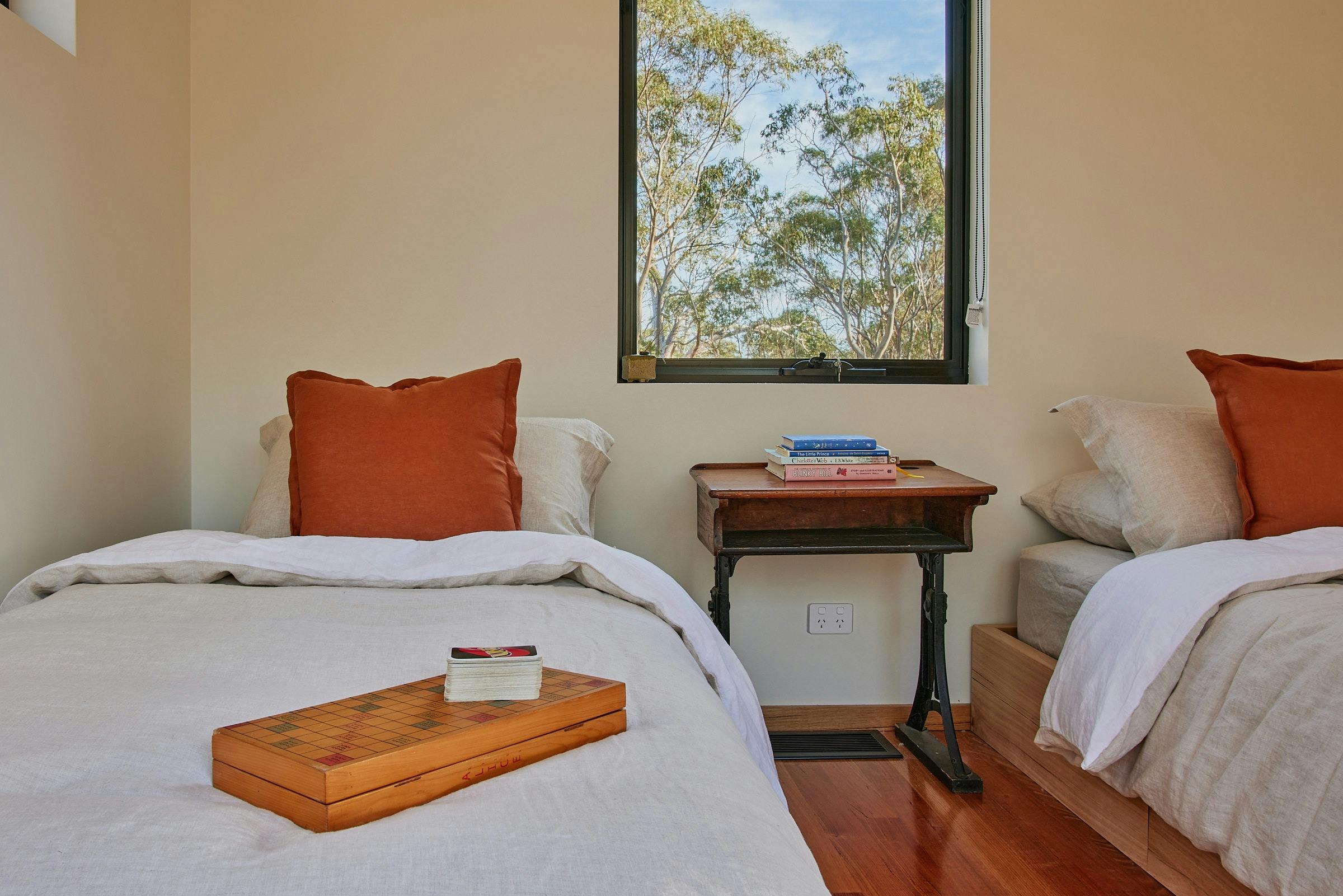 Single bed with games and antique desk