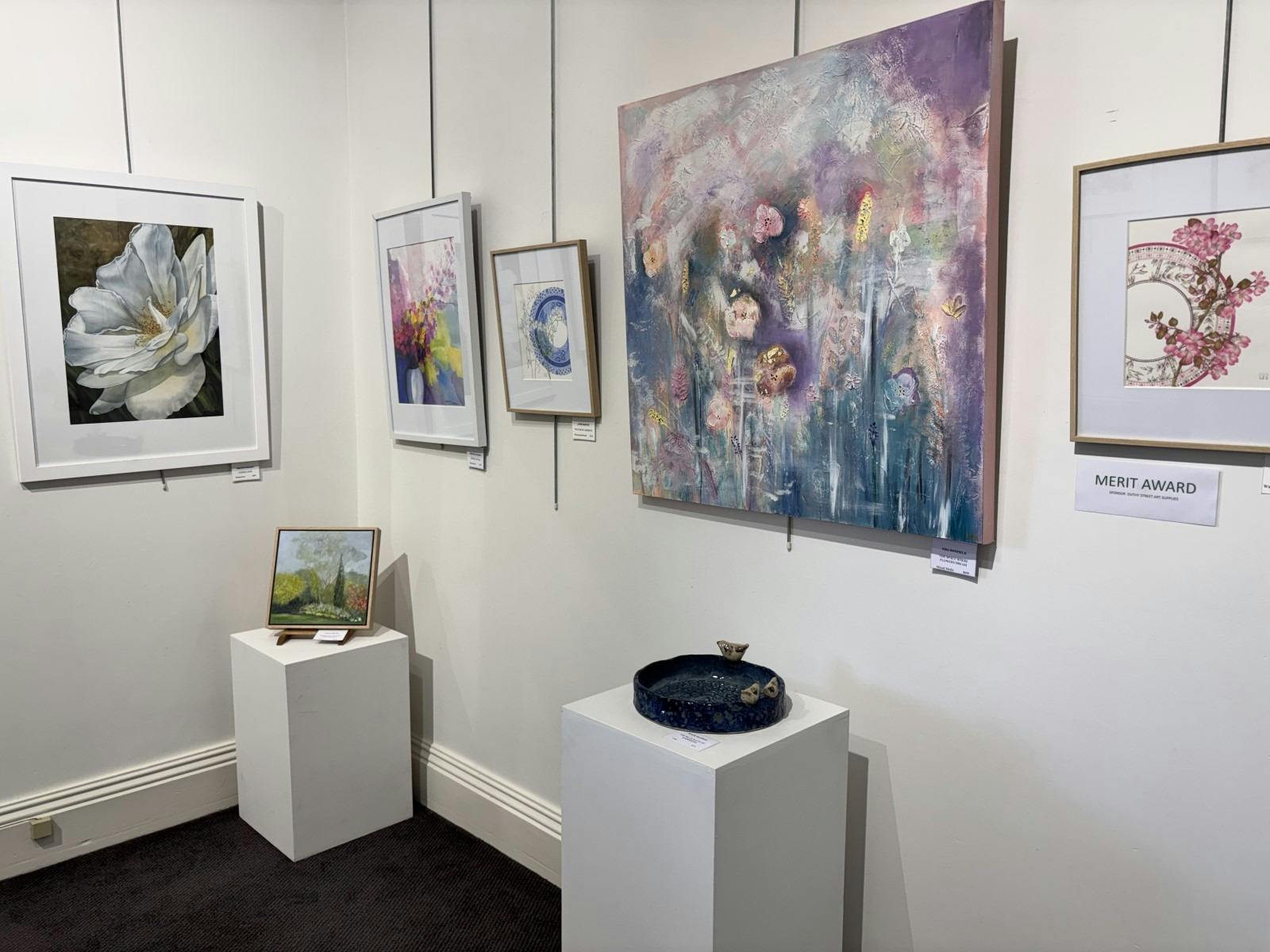 A corner of the front gallery with pieces from different artists on show.