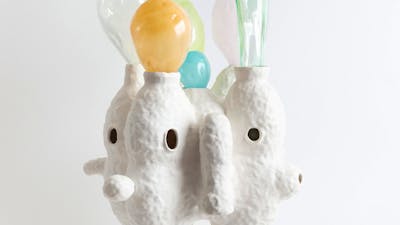 Lynda Draper artwork, made of glazed ceramic and studio blown glass, on white background