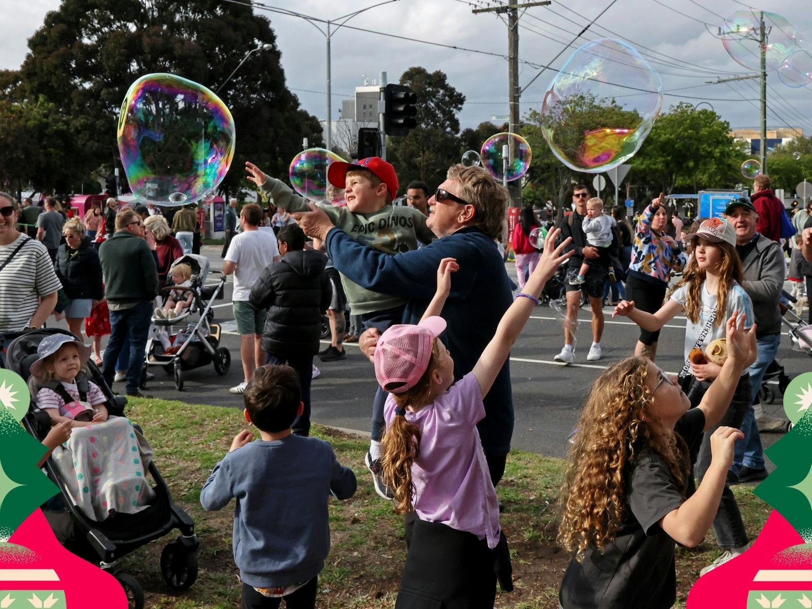 Children and families enjoy giant bubbles during free family activities at the festival.