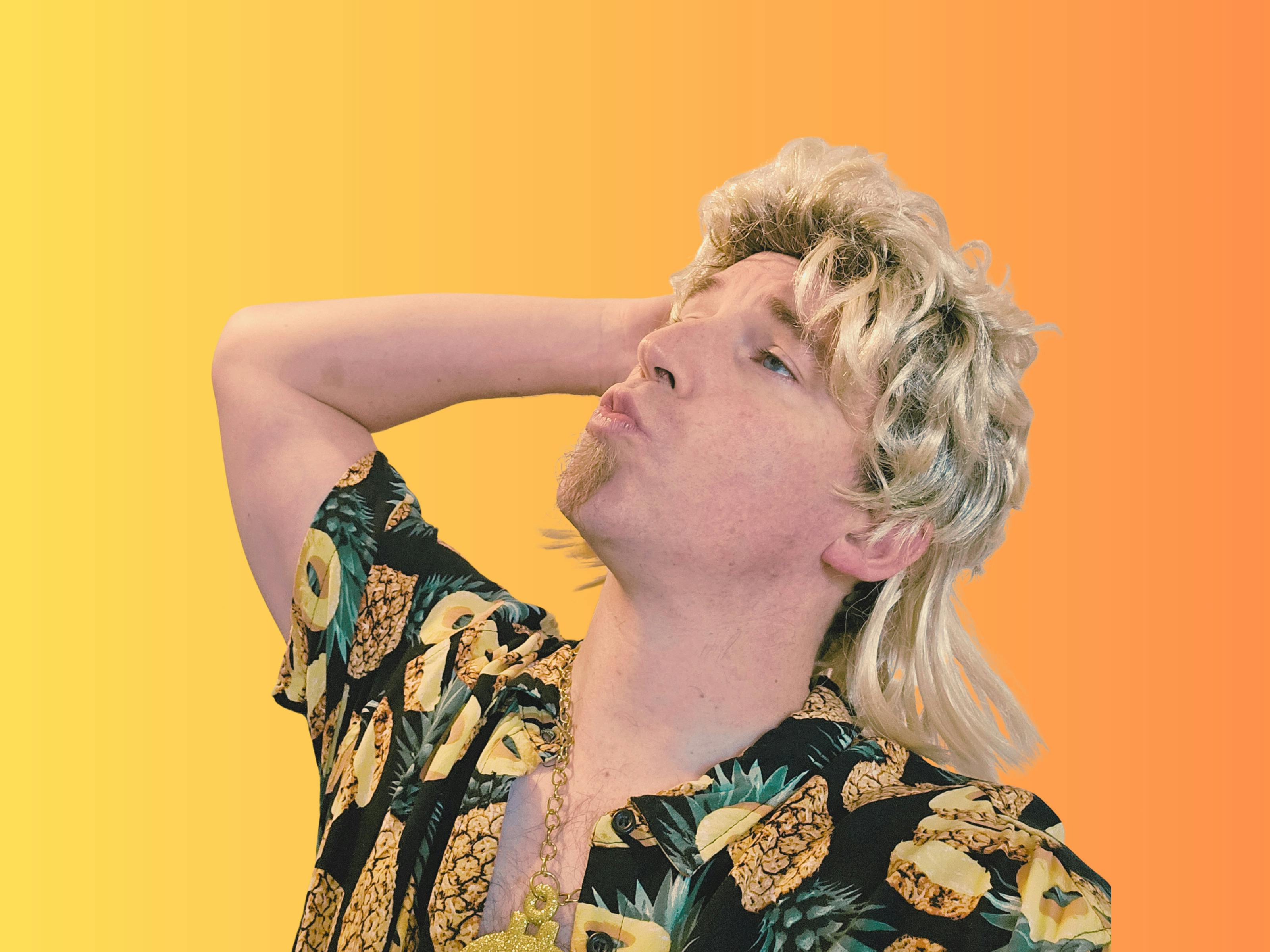 Man with blonde mullet does duck face while wearing a gold chain and a hawaiian pineapple shirt