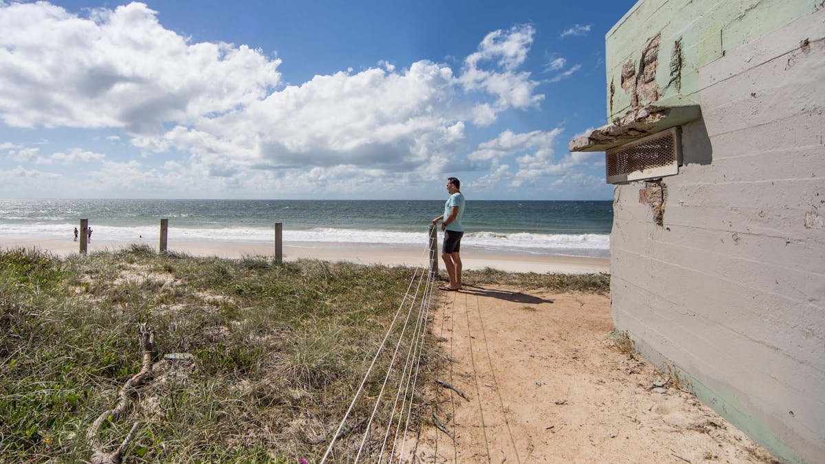 A man enjoying views of the beach at Fort Bribie