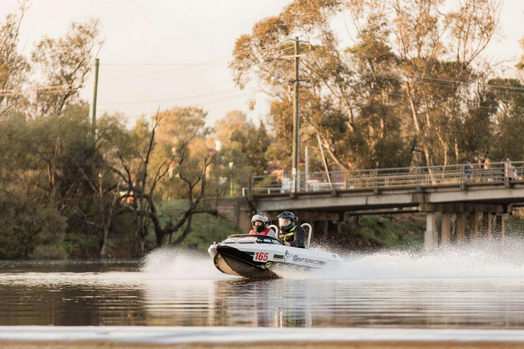 Minijet boat with two competitors on flat water