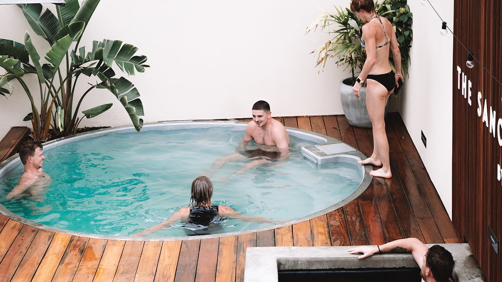 Guests sitting in the hot pool and ice bath Guests sitting in the hot pool and ice bath