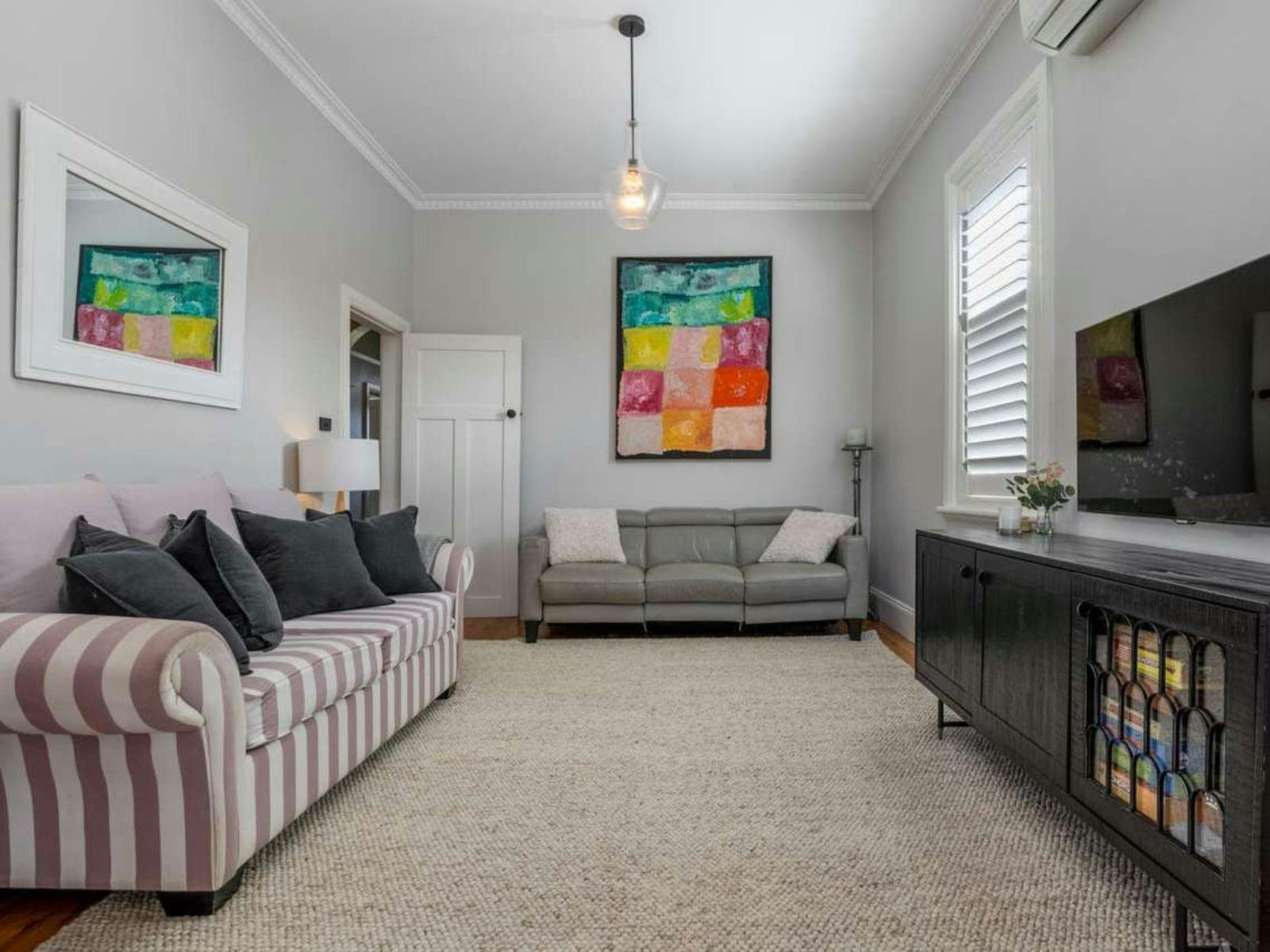 Large Living Room with lots of couch space.