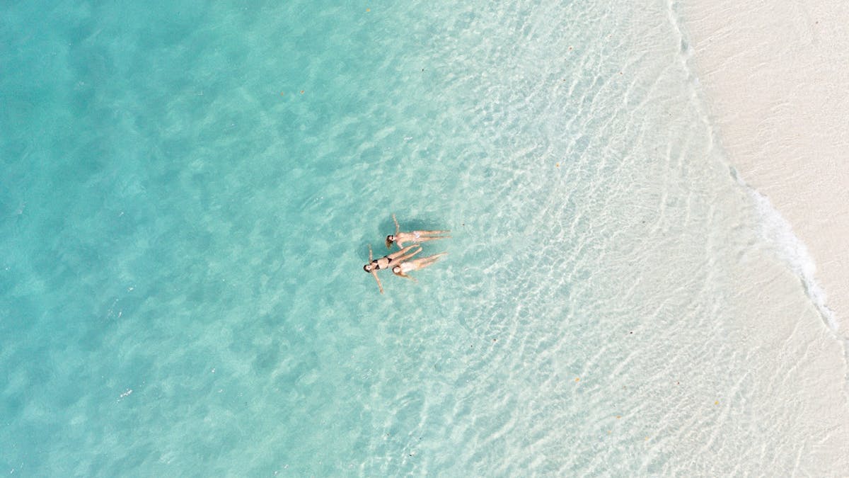 Two females swimming at Whitehaven Beach