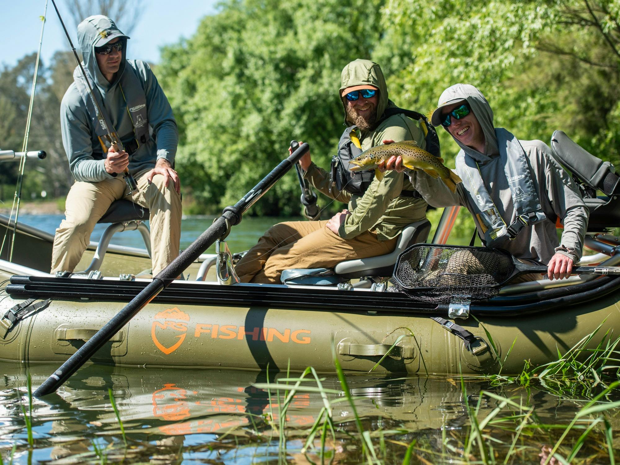 Drifting down the Tumut River fly fishing for trout.