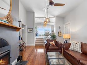 Relax by the wood fire on comfortable leather seating or take in views from the sitting room or deck