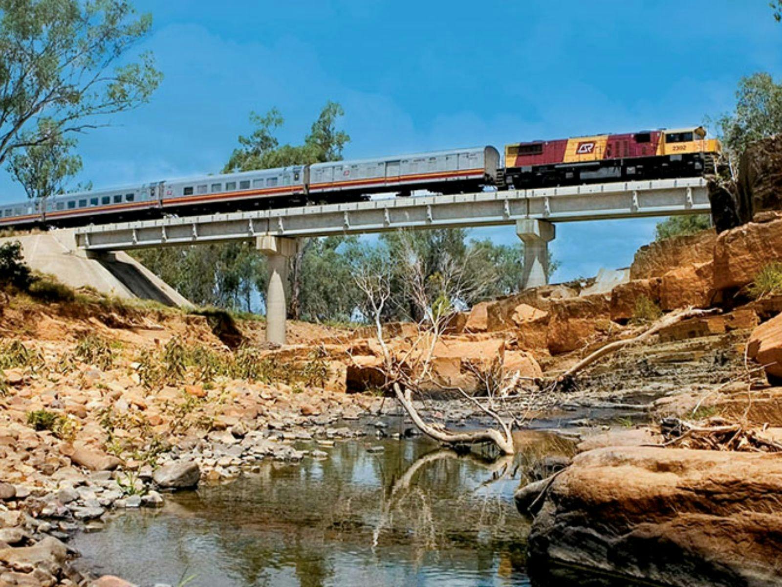 Train passing over creek