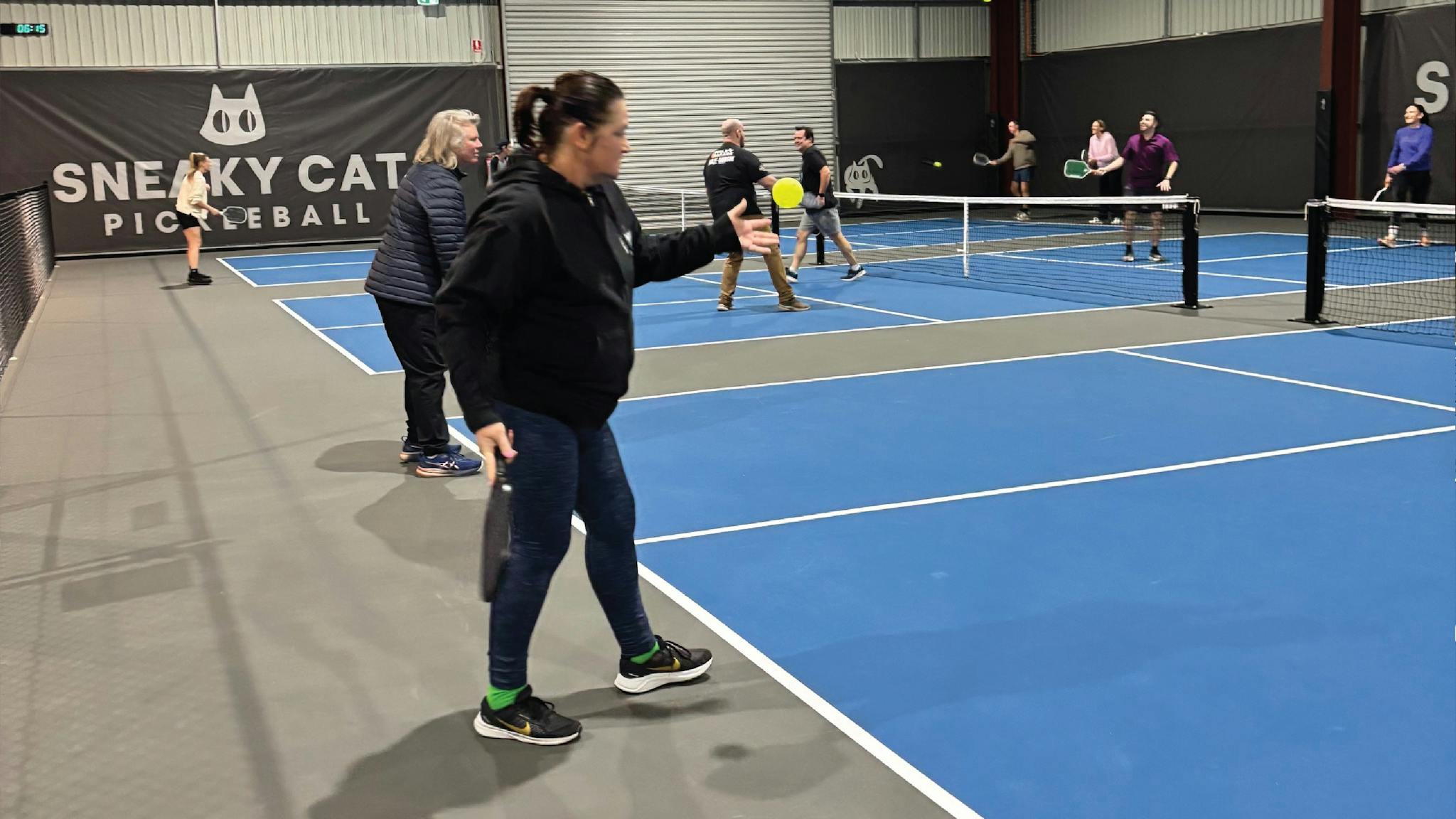 Pickleball play over three courts.