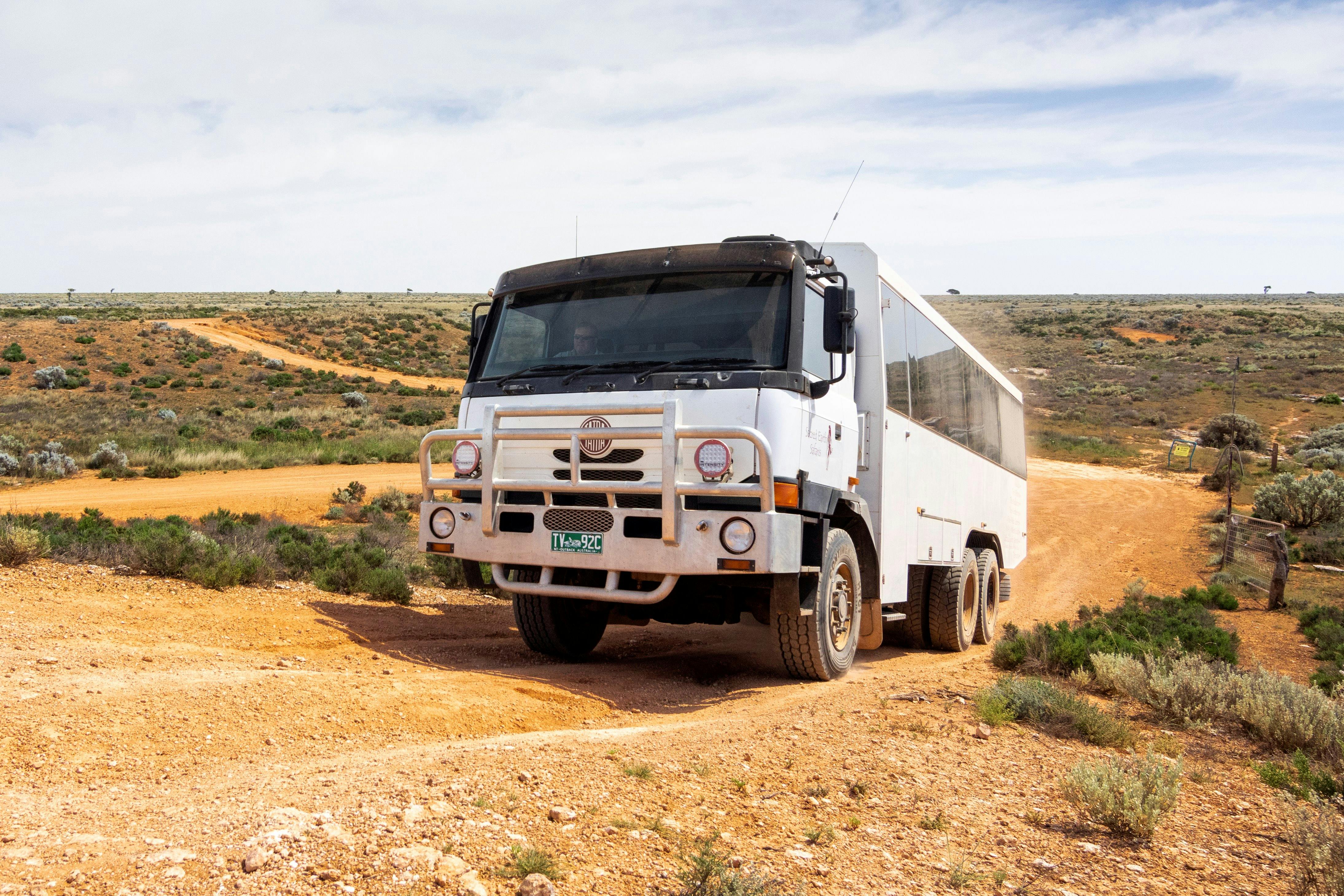 6WD coach driving on a dirt road
