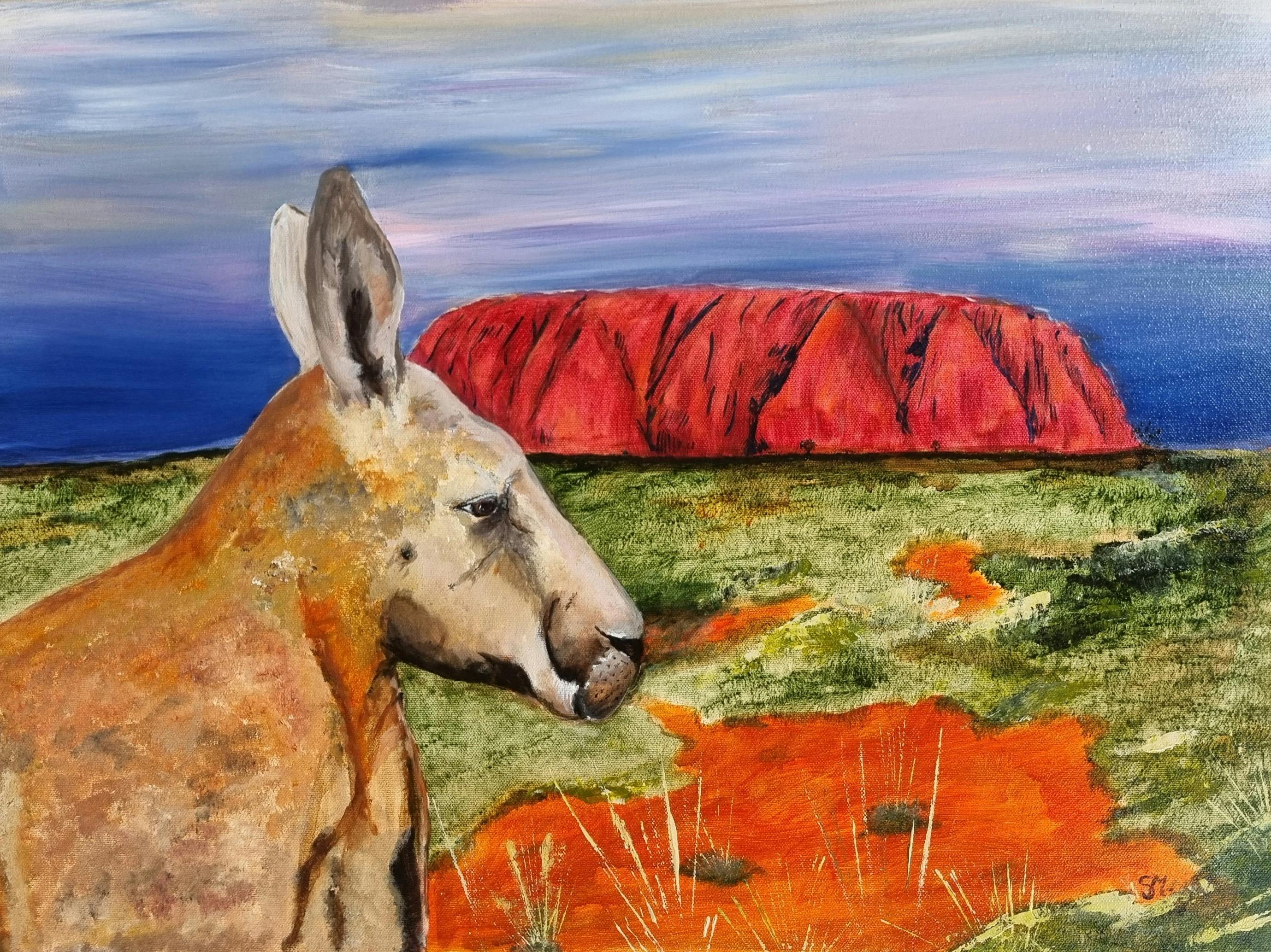 Close up painting of a kangaroo with Uluru in the background in vibrant red and a blue sky.