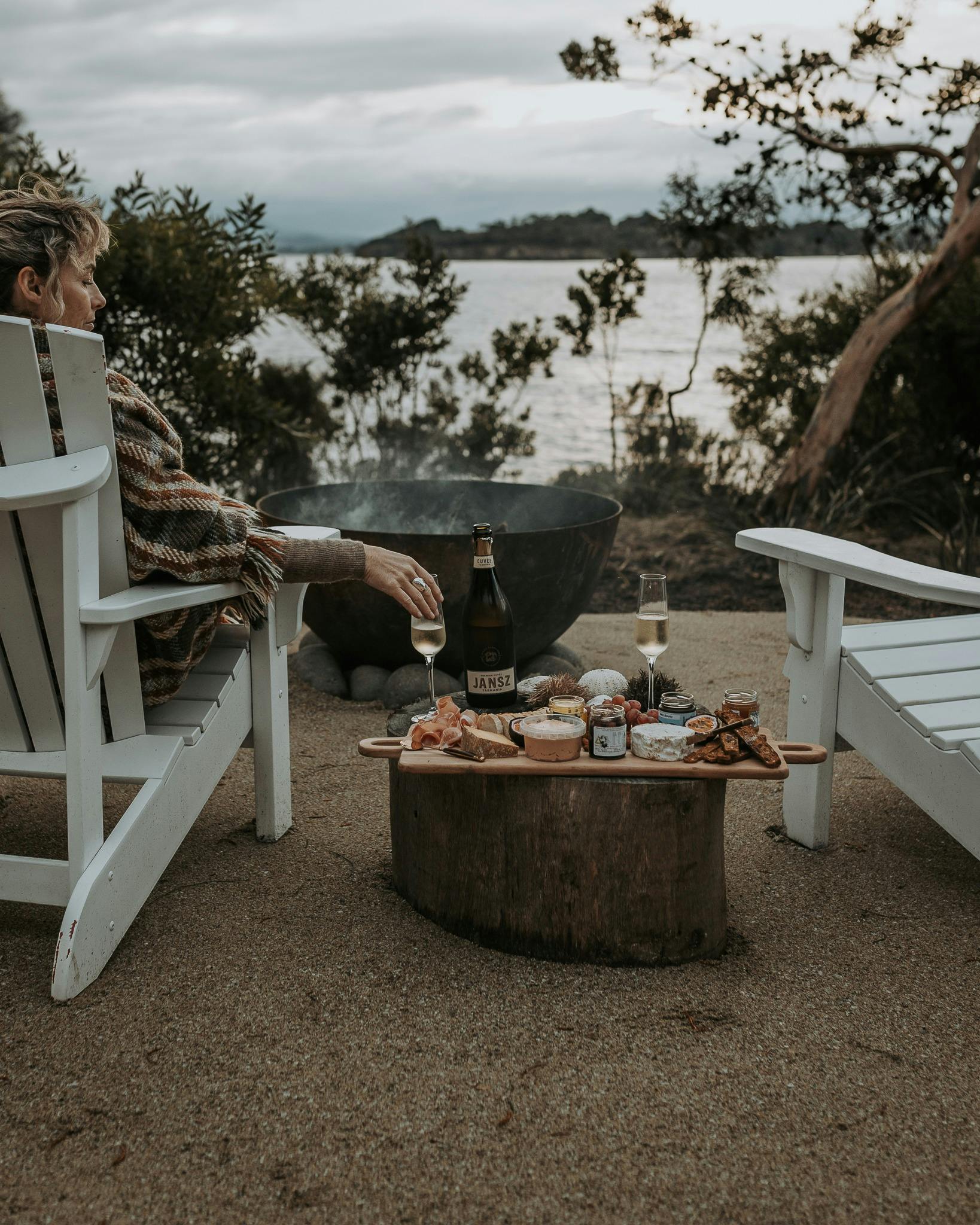 Wrapped in a cosy blanket by the firepit, enjoy a hand-curated platter
