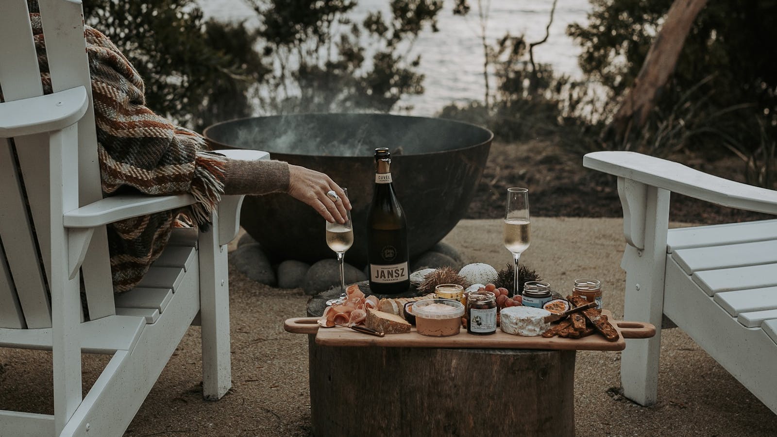 Wrapped in a cosy blanket by the firepit, enjoy a hand-curated platter