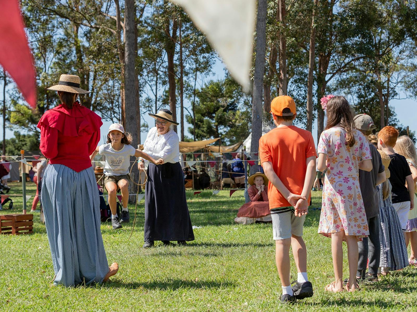 Children enjoying early colonial games