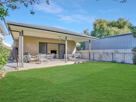Enclosed Courtyard with outdoor dining, lawn & BBQ