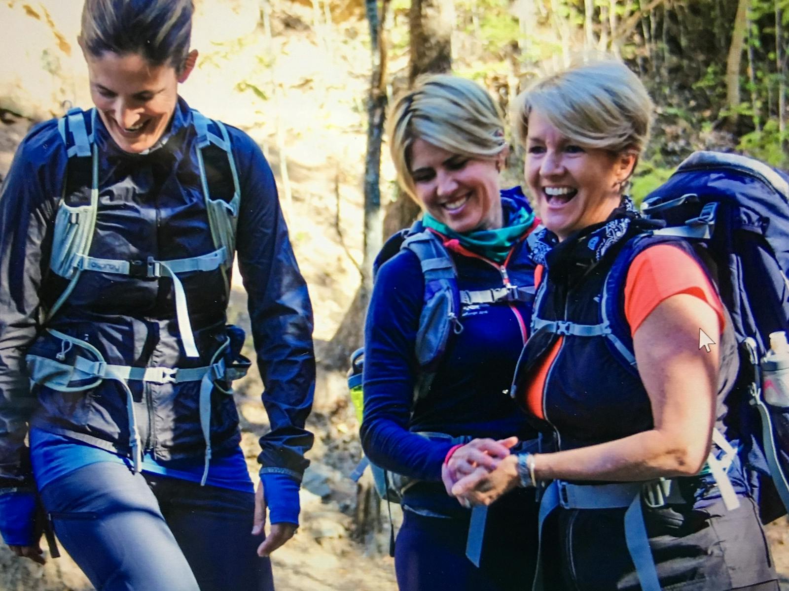 Three women connecting and laughing at Mt Coot thaa