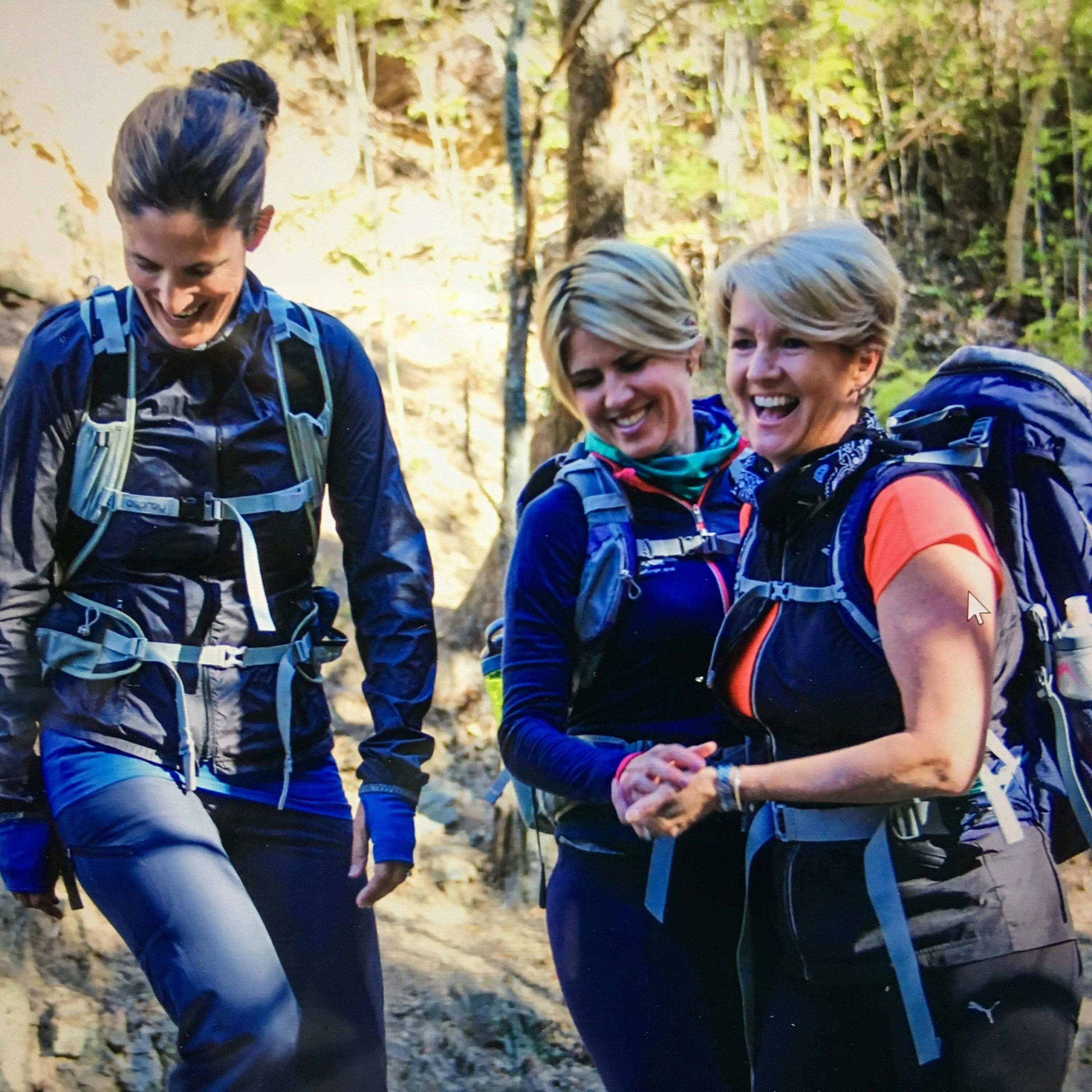 Three women connecting and laughing at Mt Coot thaa