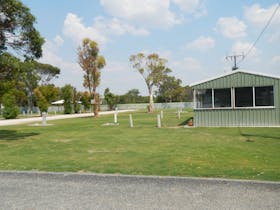 Grass sites with power & water. Located near camp kitchen, a short walk to the amenities block