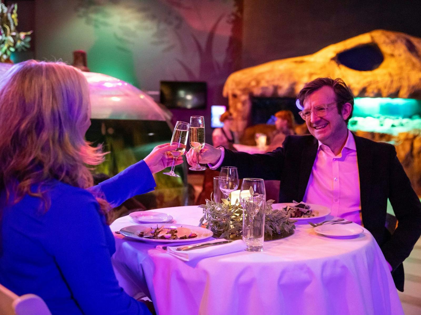Diners at SEA LIFE Sydney Aquarium clinking glasses