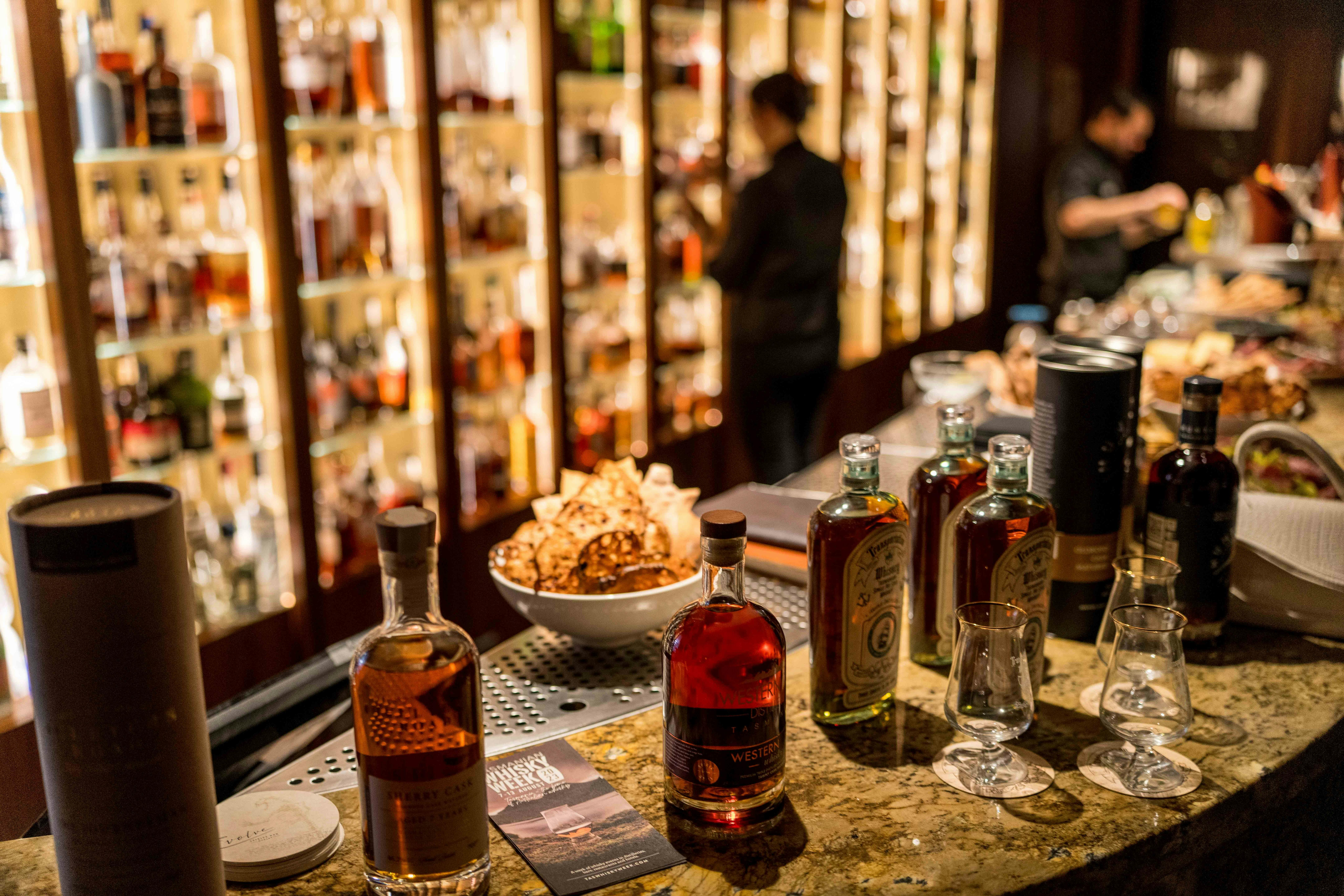 whisky bottles on a bar