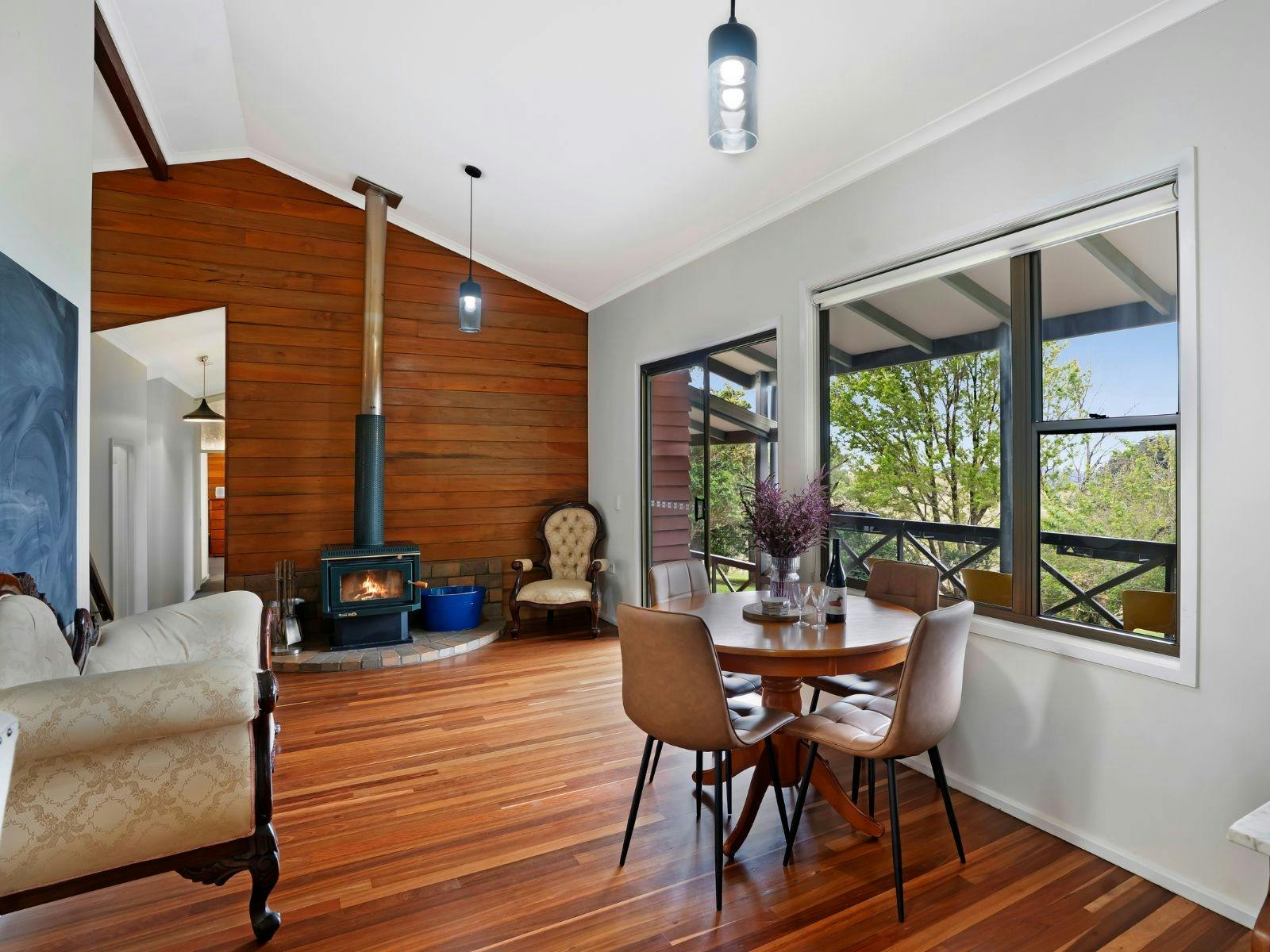 Breakfast nook with fireplace , balcony access and views of the Glass House Mountains Breakfast nook with fireplace , balcony access and views of the Glass House Mountains