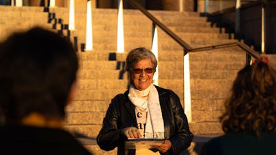 She Shapes History tour guide presenting to the group of engaged guests