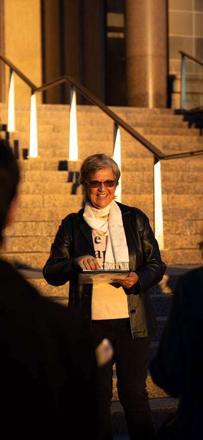 She Shapes History tour guide presenting to the group of engaged guests