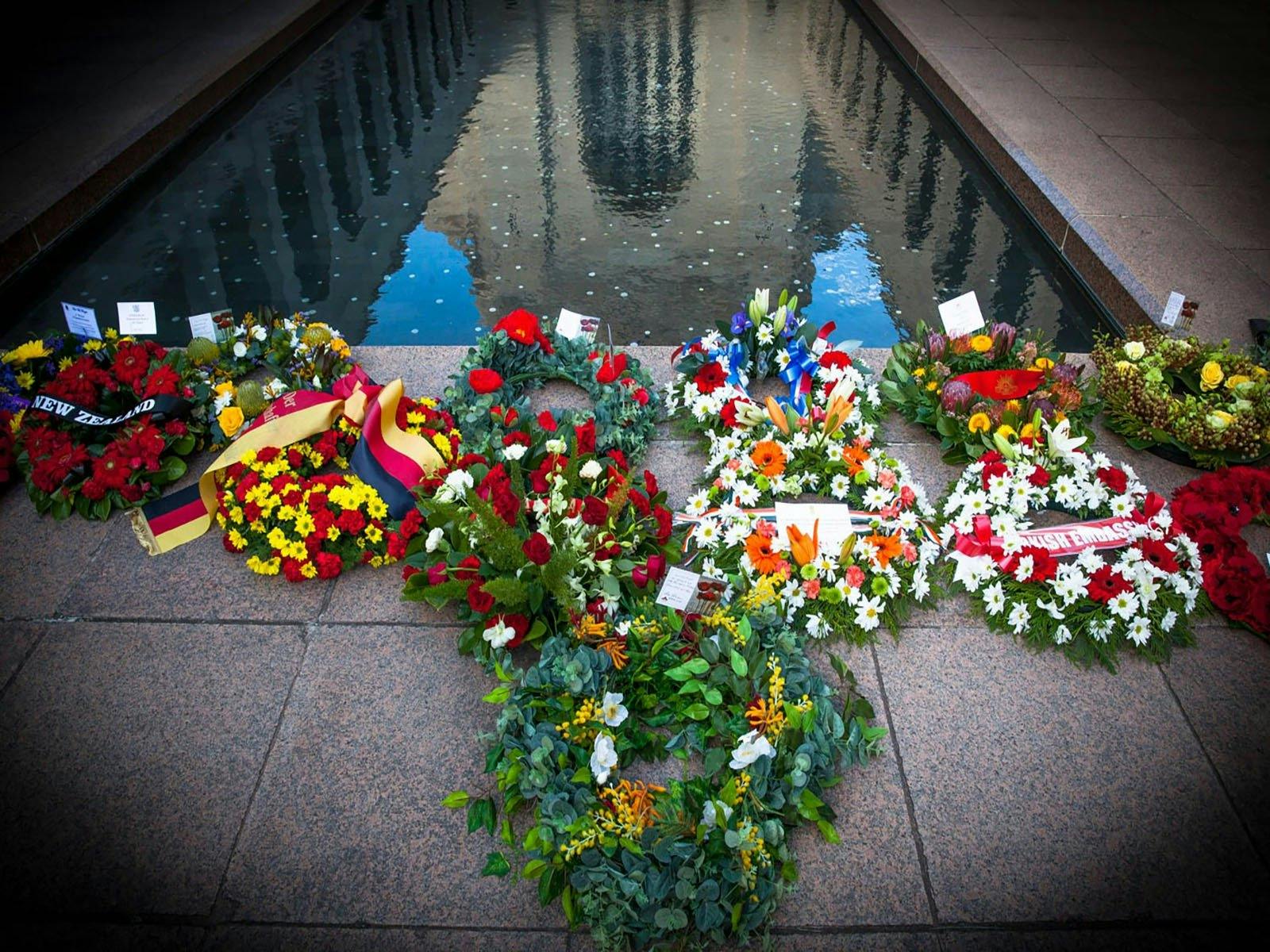 Wreaths laid at the base of the Pool of Reflection at the Australian War Memorial