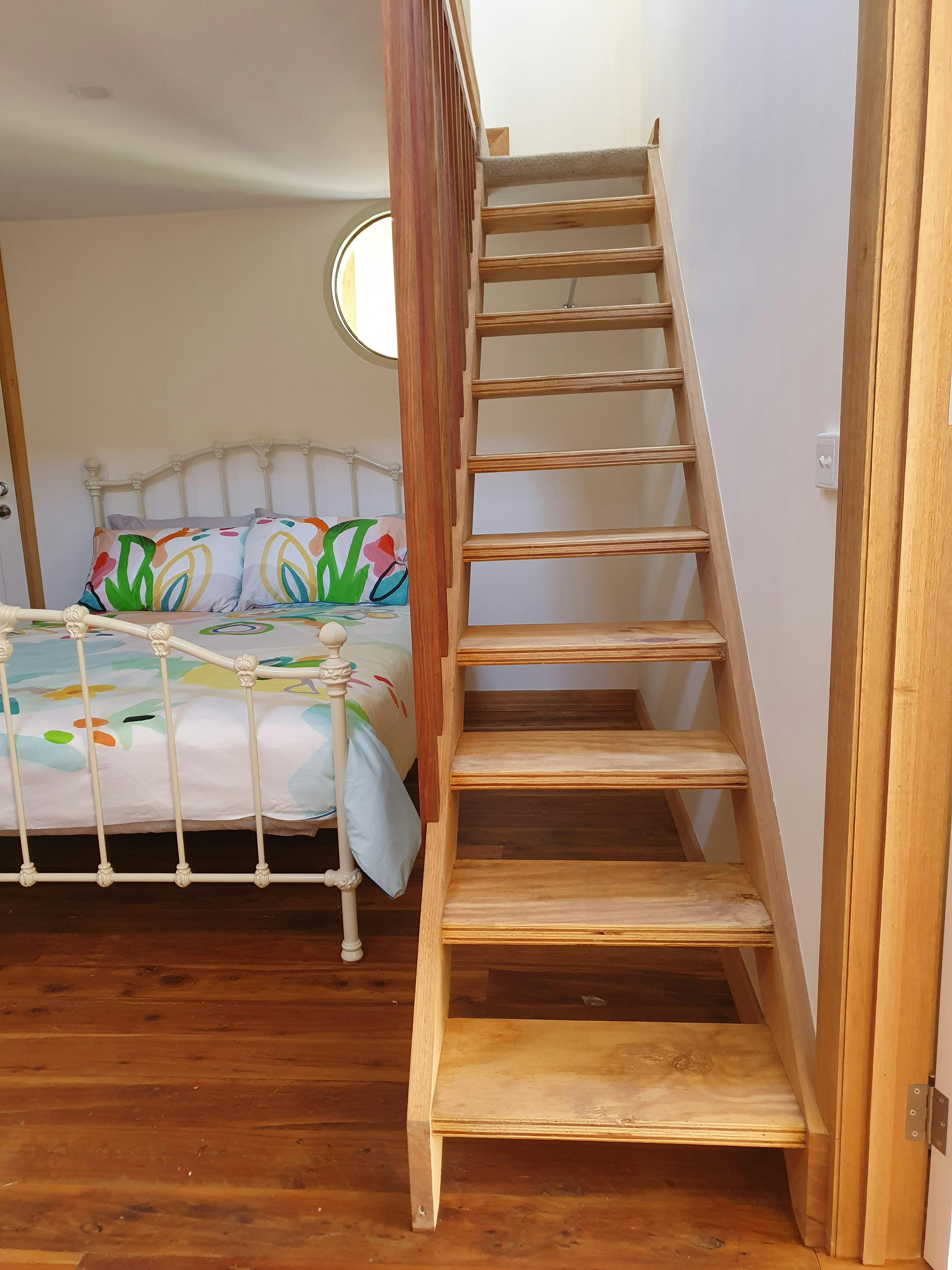 Builder put in mezzanine floor to accomodate four guests. Two single bedrooms upstairs.