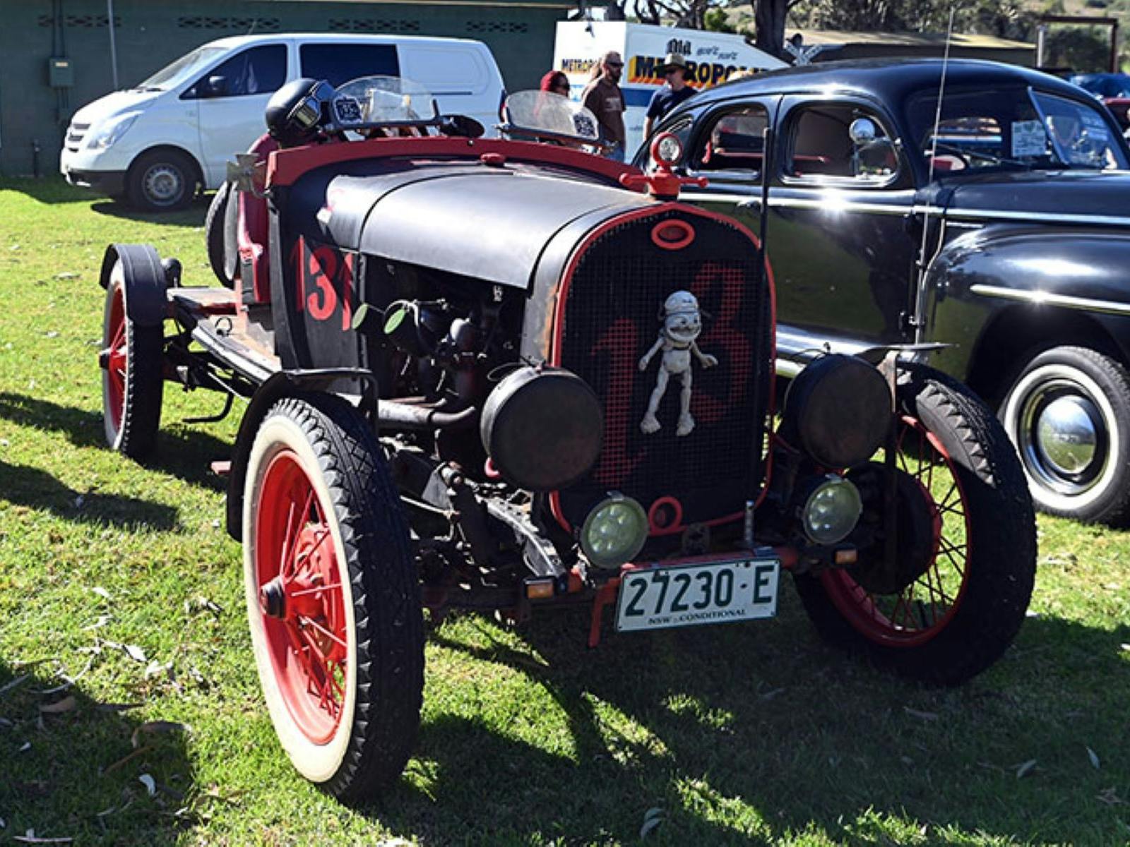 open wheel old race car with crazy frog on the front