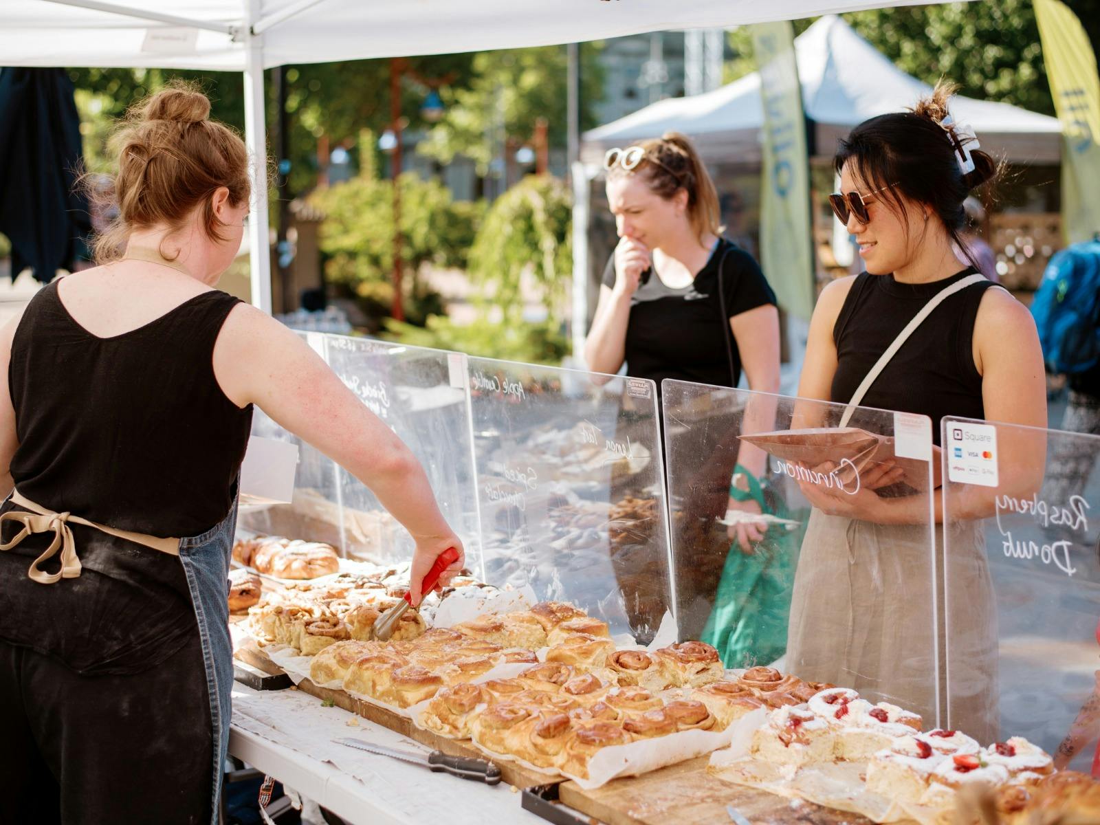 a Lady purchasing baked sweets from the Bendigo Farmers Market