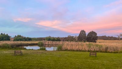 A dam with a sunset background