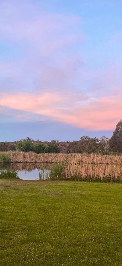 A dam with a sunset background