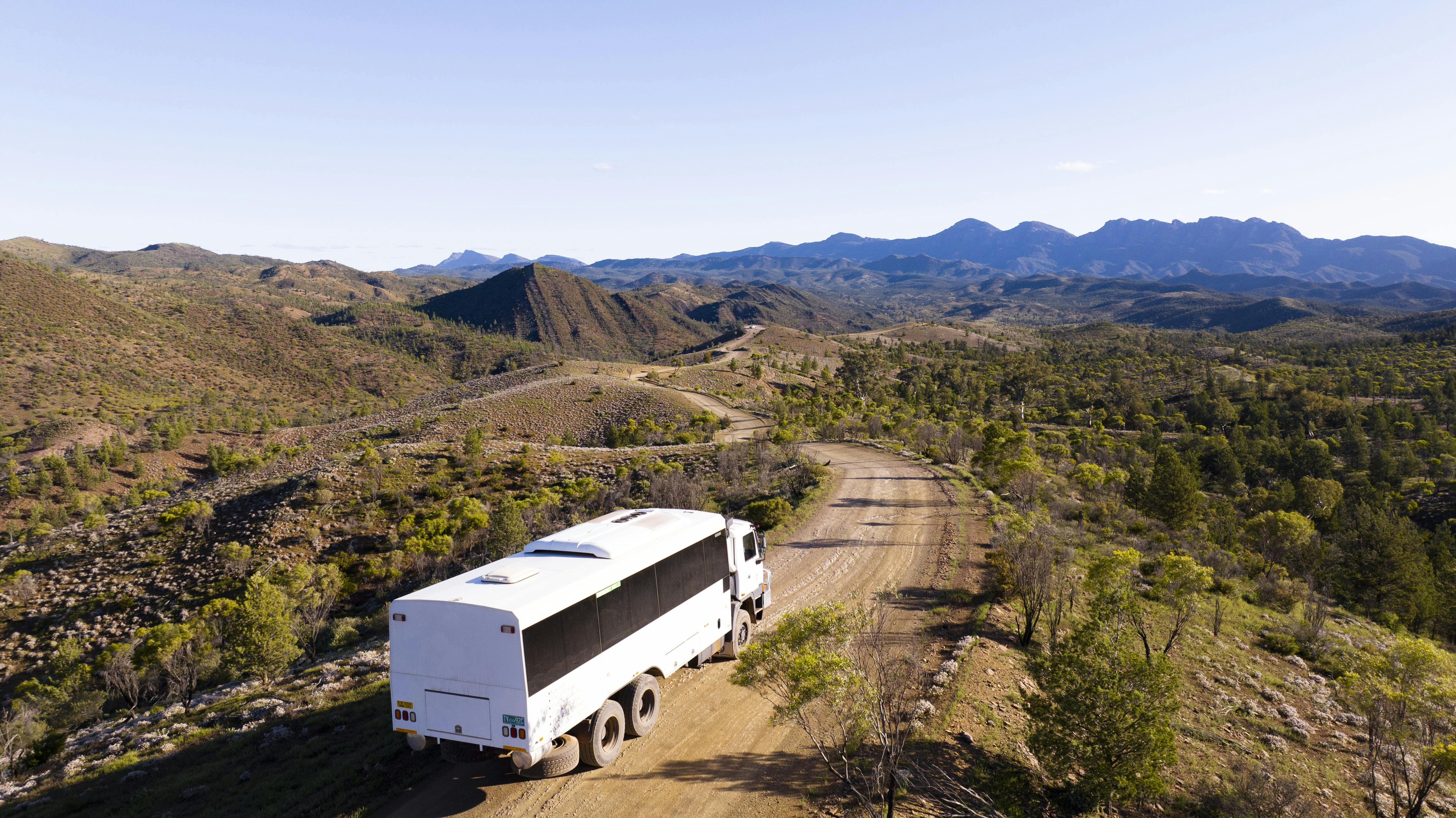 6WD coach driving through a mountain range