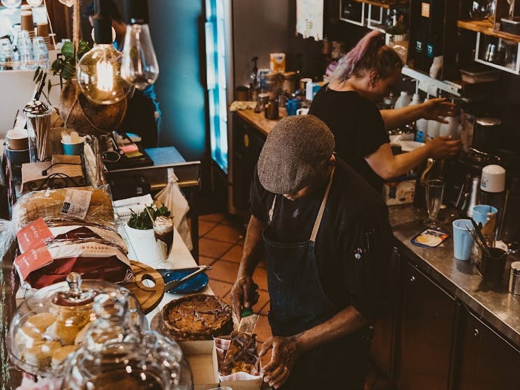 Overhead photo of people preparing food in cafe