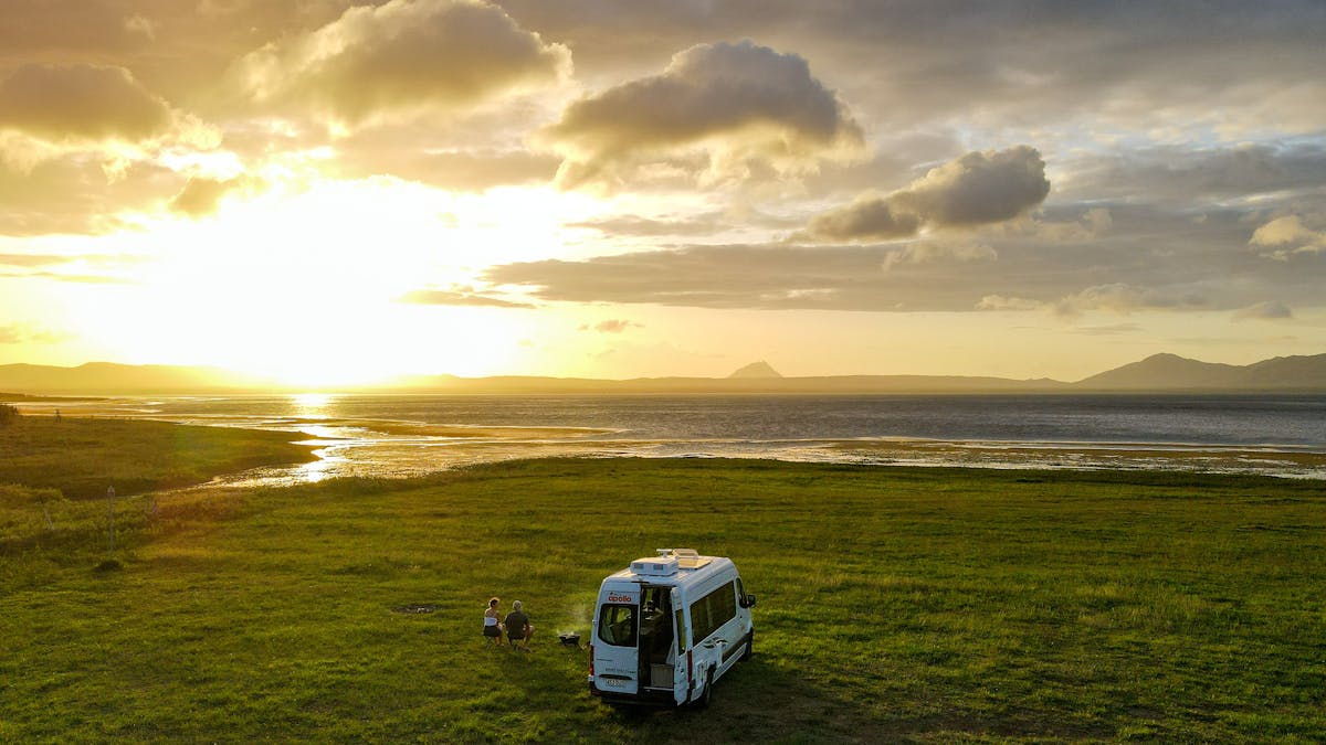 one campervan at the shores of Lake Proserpine during sunset