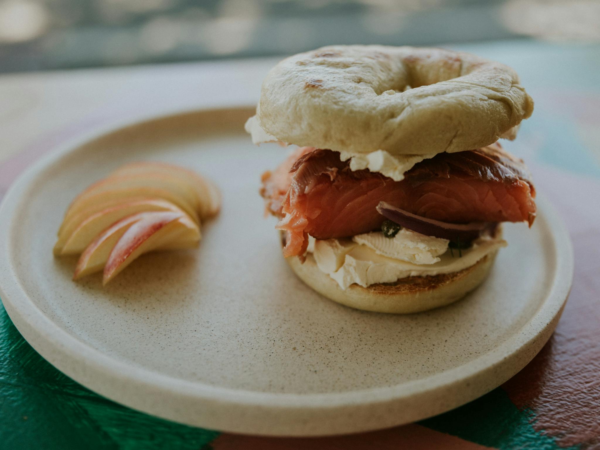 Toasted smoked salmon bagel with fruit
