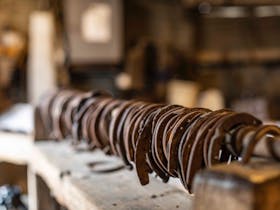 Display of old horse shoes at Angaston Blacksmith Shop and Museum