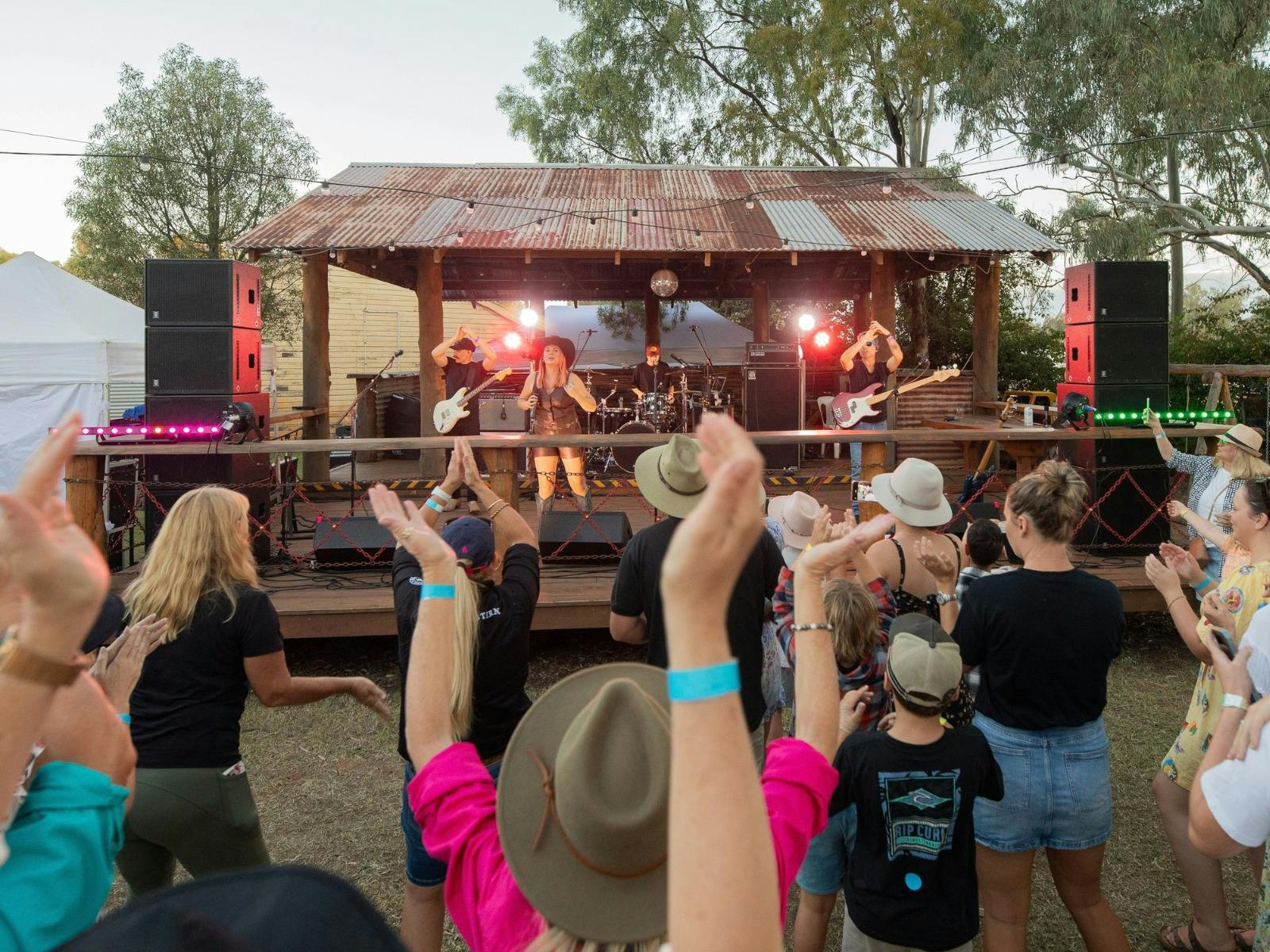 Outback Trail event stage with Trail Travellers dancing, clapping and enjoying the music